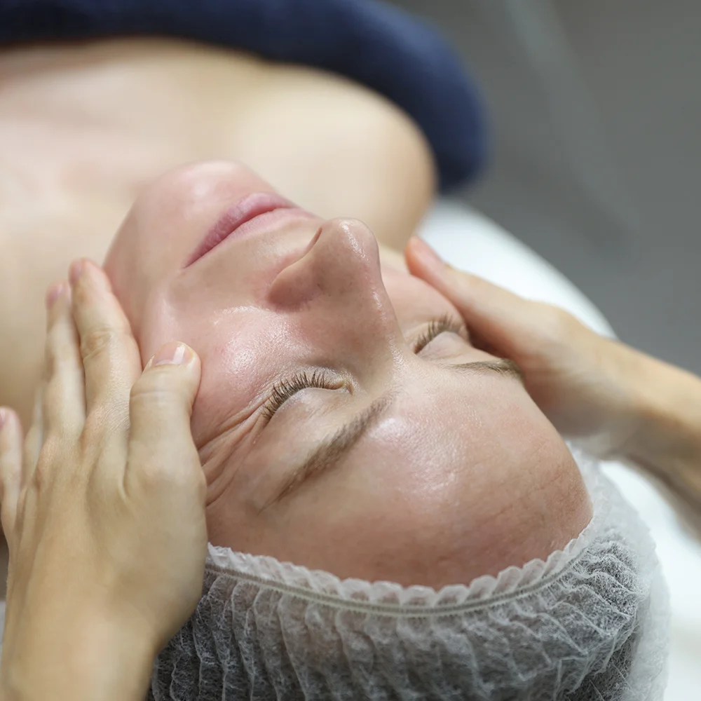 Patient receiving OmniClear facial at Omniya Clinic